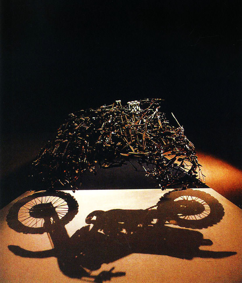 shadow sculpture motorbike optical illusion